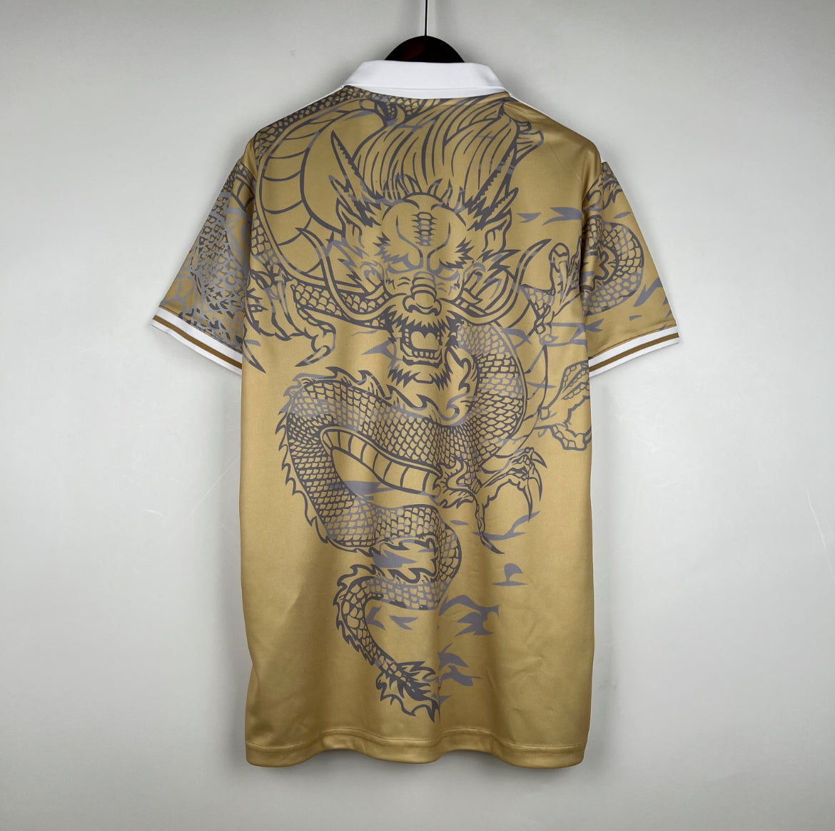 Maillot Real Madrid dragon polo doré